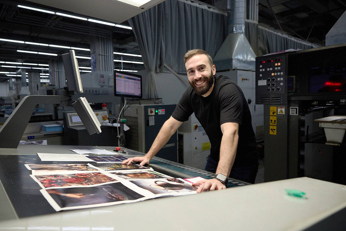 Arim Hawsho in the printing factory, approving a printed sheet of eight pages
